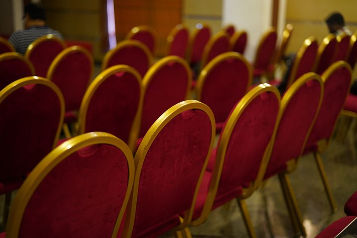 Empty chairs in a meeting room.